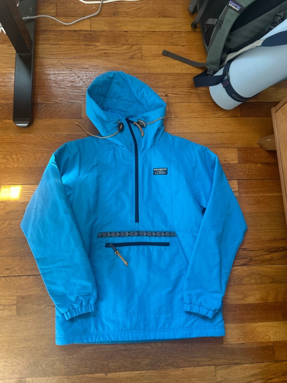L.L.Bean blue windbreaker jacket with hood and zipper pockets. Size: XXS